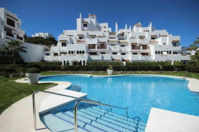 36 Apartment with large garden, pool and padel court in Golf Hills Estepona